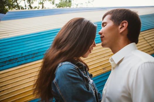 Beautiful young couple on the city background.