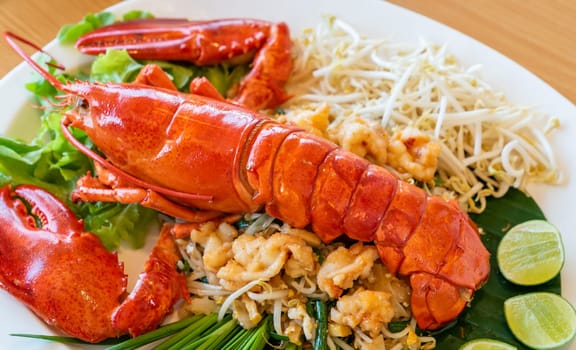 Lobster Pad thai, stir fried Thai rice noodle pasta with whole lobster and lobster meat.