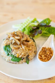 egg fried rice with fried Gourami with organic vegetable.
