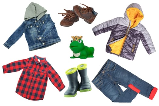 Collage set of children clothes. Denim jacket and pants, shoes and rain jacket for child boy isolated on a white background. Concept spring autumn and summer clothes. Clos-up.