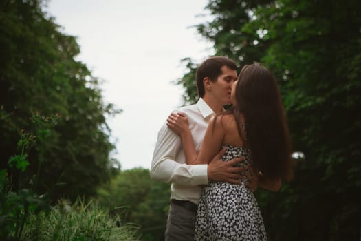 Beautiful young couple on a nature background.