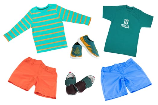 Top view on child boy set of clothes. Collage of apparel clothing. Short pants , shirt, shoes and sneaker isolated on a white background. Summer fashion.