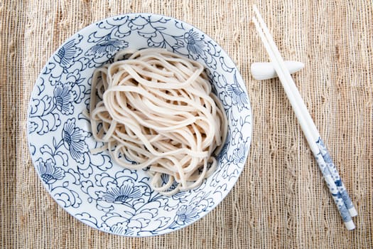 Filling bowl with udon noodle soup series image two: bowl with udon noodls