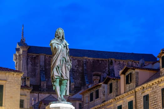 Blue hour view a statue of Ivan Gundulic in Dubrovnik, Croatia