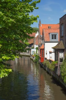 One of the peaceful canals in the downtown of Bruges (Belgium)