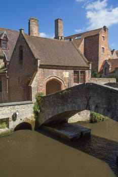 The famous ancient old stone bridge in Bruges (Flanders, Belgium)