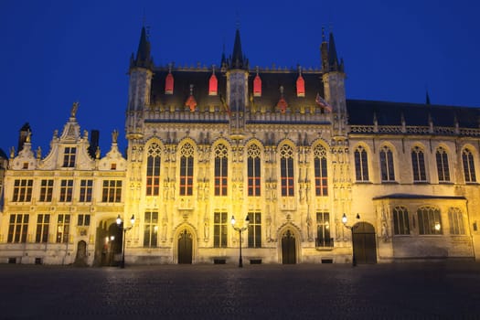 The Town Hall and the Burg Square in Bruges at night (Belgium)