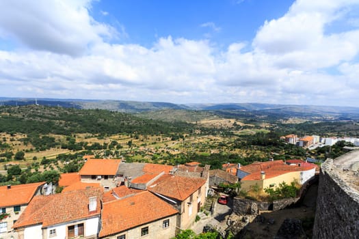 Panoramic view of the beautiful historic village of Celorico da Beira, Beira Alta, Portugal, with the surrounding mountains in the background