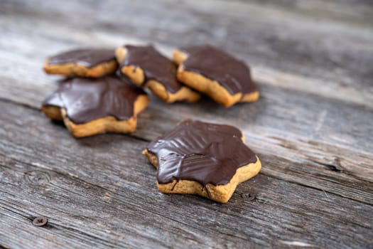homemade gingerbread stars on gray wooden ground