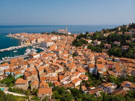 Aerial view of old town Piran. Splendid summer day on Adriatic Sea. Beautiful cityscape of Slovenia, Europe. Traveling concept background. Magnificent Mediterranean landscape.