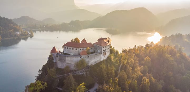 Aerial view of medieval castle by the lake Bled in Slovenia. Beautiful nature of Slovenia in fall.