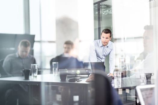 Business team brainstorming on meeting in modern corporate office. Business executive delivering presentation to colleagues during meeting or in-house business training. Business and entrepreneurship.