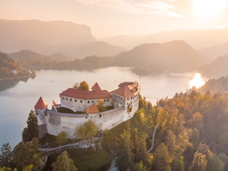 Aerial view of medieval castle by the lake Bled in Slovenia. Beautiful nature of Slovenia in fall.