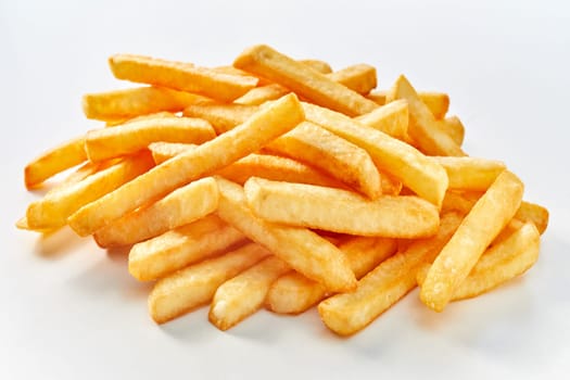 Heap of long french fries on white background.