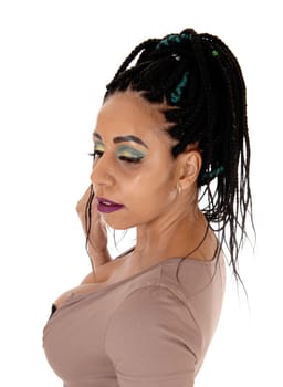 A close up portrait of a woman with her nice braided black.long hair in profile, isolated for white background.