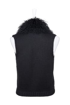 Vest isolated. Black women vest with a large fur collar on mannequin isolated on a white background. Woman fashion. Back view.