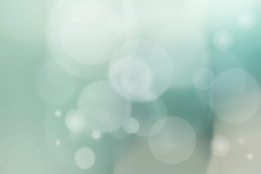 Abstract underwater illustration. Abstract light green blue bokeh circles from unterwater bubbles. Beautiful green blue texture.