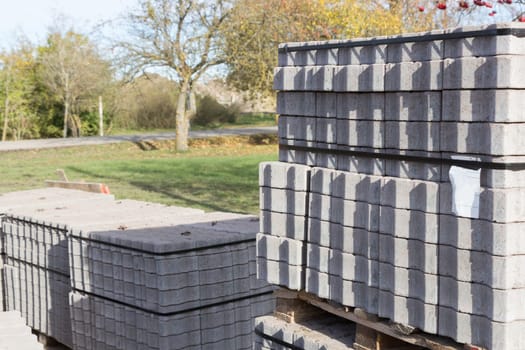 packages with new paving stones near the construction site