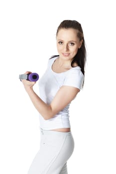 Young sports woman with dumbbells on a white background. Training.