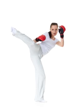 Sporty young woman in red fighting gloves on a white background.