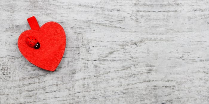 Red hanging hearts with ladybug
