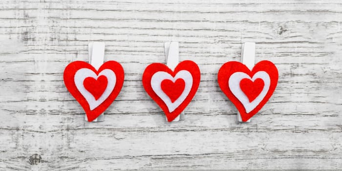 Valentines day with red hearts on wooden background