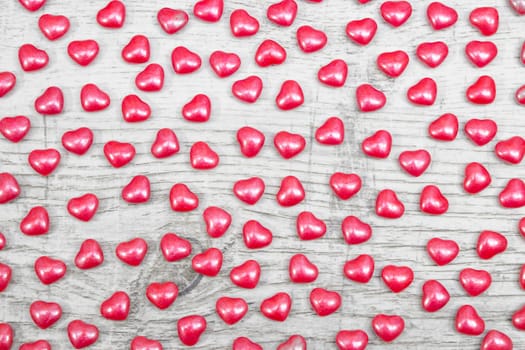 Valentines day with red heart Jellys on wooden background