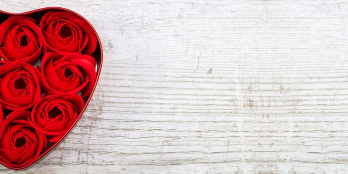 Red roses in a heart-shaped box