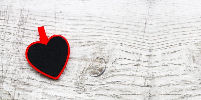 Valentines day with red hearts on wooden background