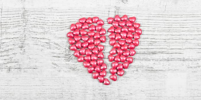 Valentines day with red heart Jellys on wooden background