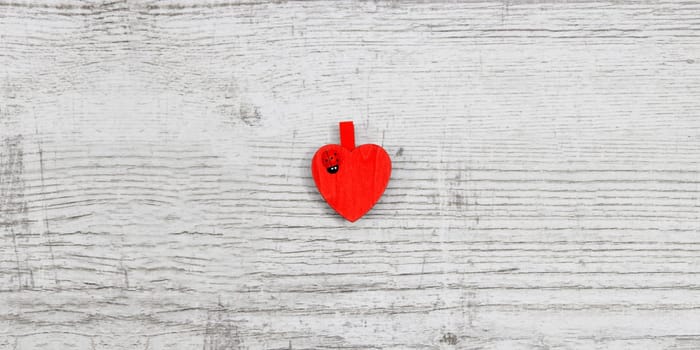 Red hanging hearts with ladybug