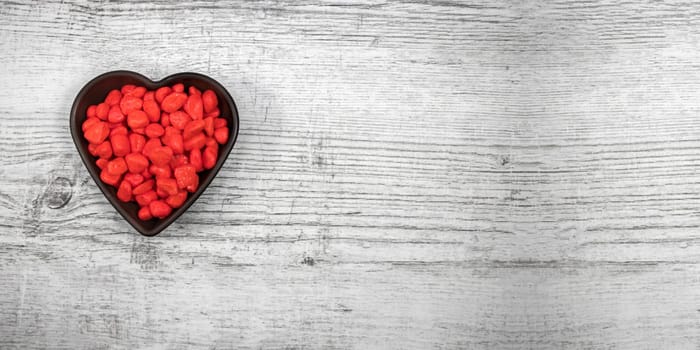 Red Pebble Stones on Wooden Background - Valentine's Day