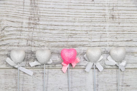 Heart chopsticks on wood background