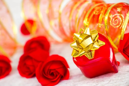 Surprise ring box and red roses on Valentine's Day