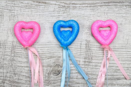 Heart chopsticks on wood background