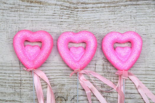 Heart chopsticks on wood background