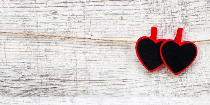 Valentines day with red hearts on wooden background