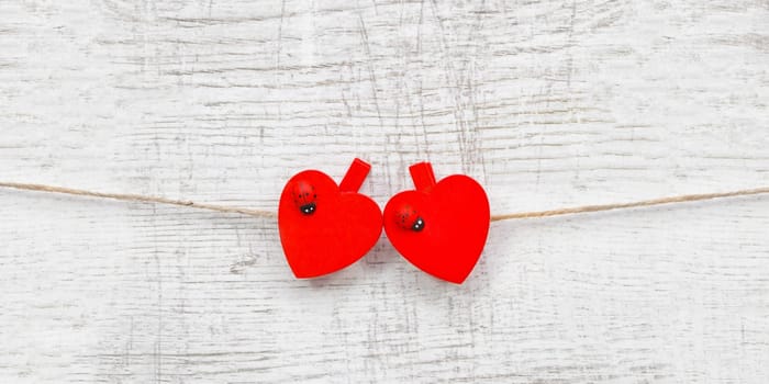 Red hanging hearts with ladybug