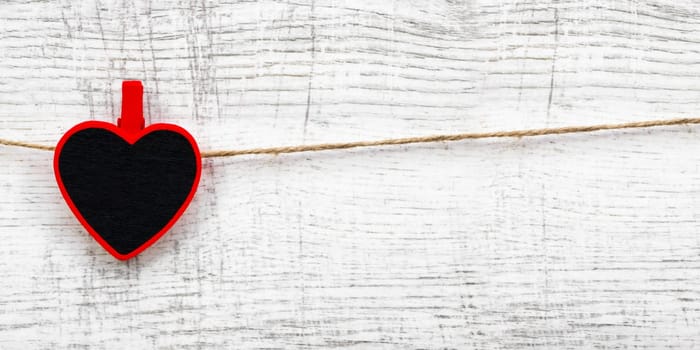 Valentines day with red hearts on wooden background
