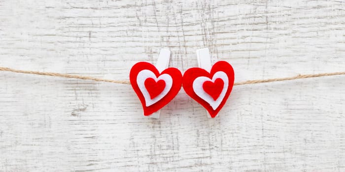 Valentines day with red hearts on wooden background