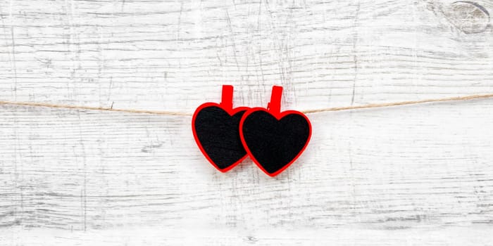 Valentines day with red hearts on wooden background