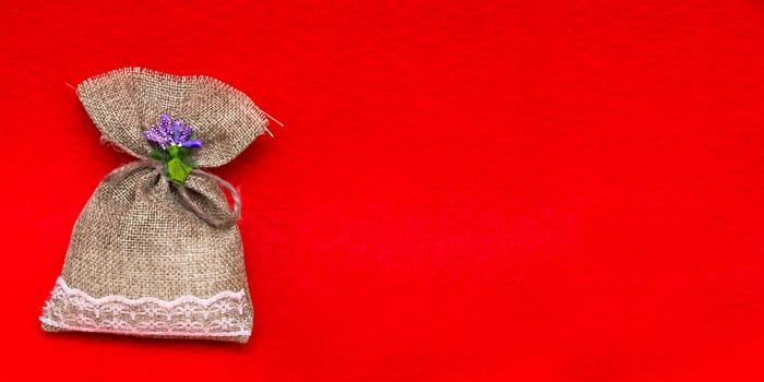Small gift sack in red background