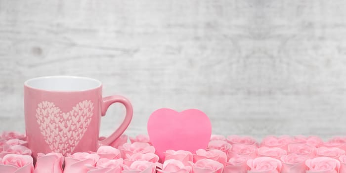Pink porcelain coffee cup and pink heart roses -Valentines day