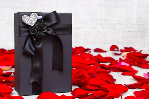 Surprise gift boxes on rose petals, valentines day