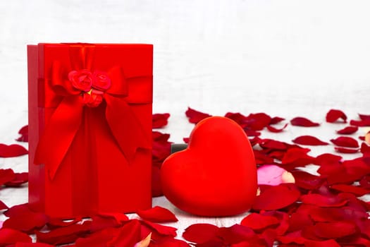 Surprise gift boxes on rose petals, valentines day
