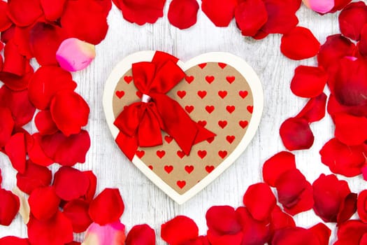 Surprise gift boxes on rose petals, valentines day