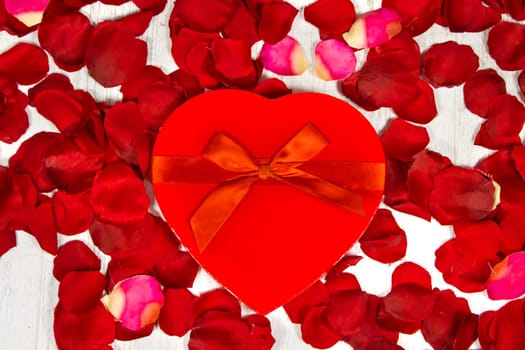 Surprise gift boxes on rose petals, valentines day