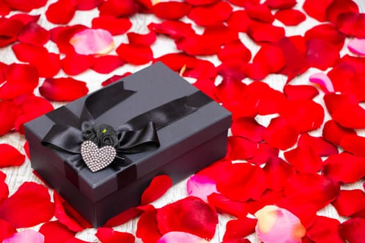 Surprise gift boxes on rose petals, valentines day