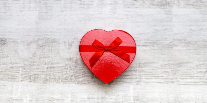 Red gift box with red ribbon and bow
