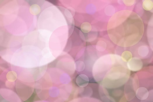 Pink bright abstract bokeh. Pink and purple gradient glowing background with bright blurred circles. Beautiful texture.